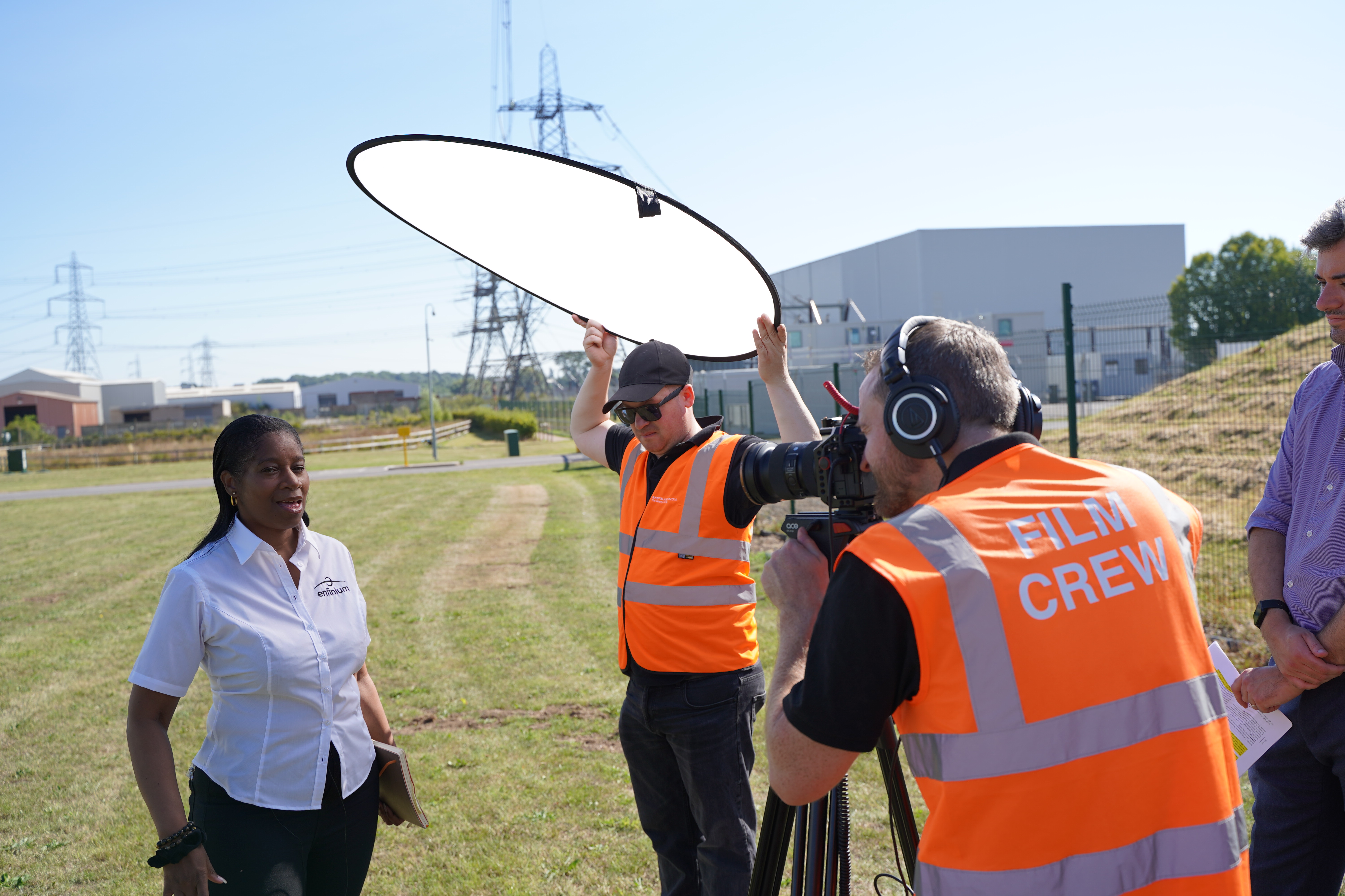 Video production crew setting up outdoor interview lighting — freelance film crew Leeds